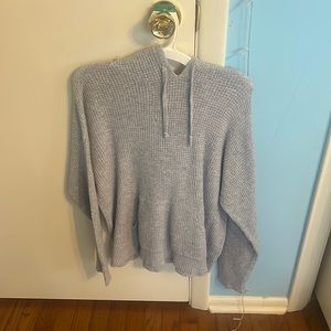 grey textured sweater with a hood